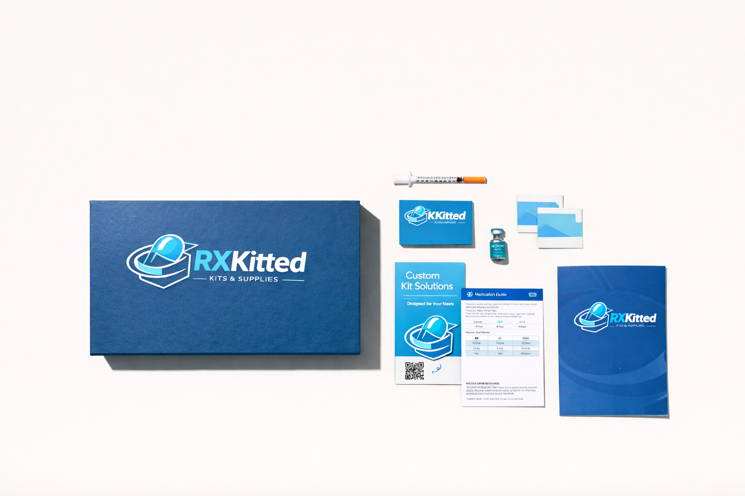 RXKitted branded packaging flat lay with branded box, syringe, vial, medication guide, and inserts